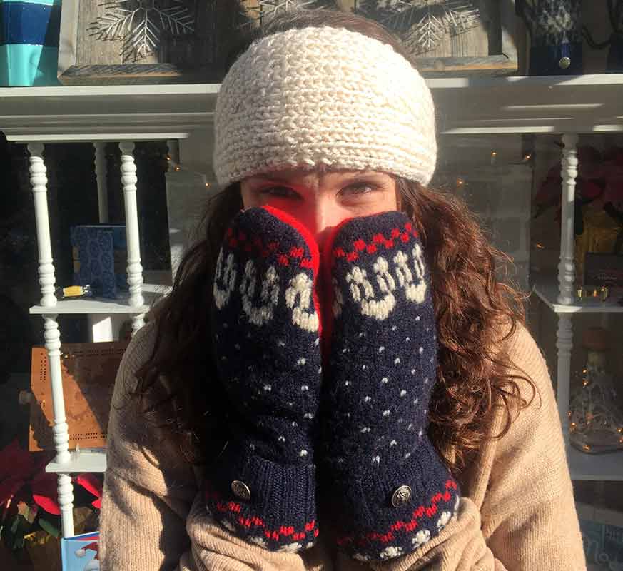 Marissa wearing recycled sweater, fleece-lined mittens
