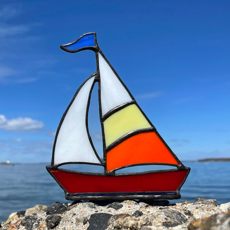 Yellow & Orange Sails on a Red Boat Stained Glass Sailboat