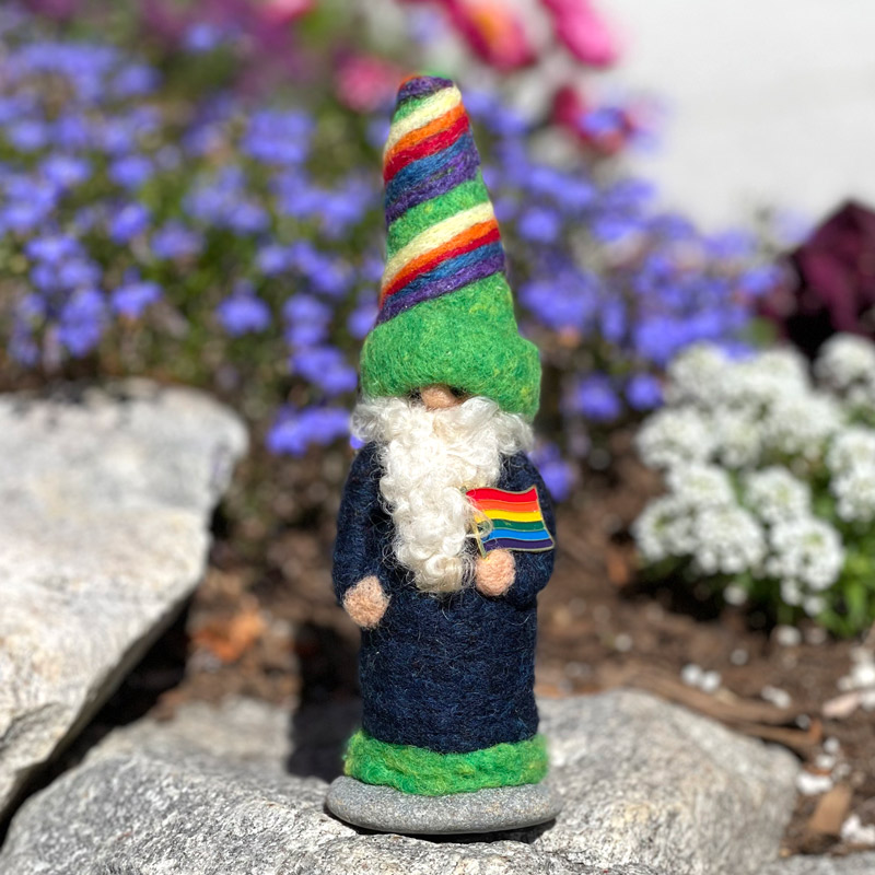 Rainbow Gnome wearing Blue and holding a Rainbow Flag