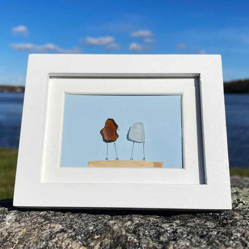 Amber & Clear Sea Glass on Light Blue Background