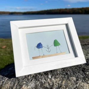 Blue & Green Sea Glass with anchor on light blue background