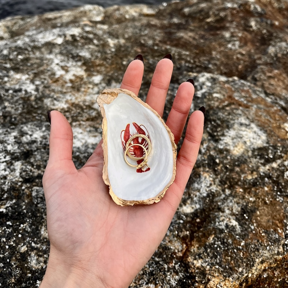 Small Red Lobster Oyster Shell Ring Dish holding gold rings