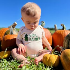 Little Mainer Onesie on baby F in pumpkins